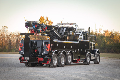 Century M65 on a black Peterbilt 589 Simard twin-steer chassis rear folded