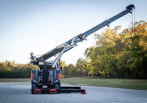 Century M65 on a black Peterbilt 589 Simard twin-steer chassis rear stretched off the side